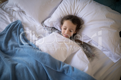 Girl sleeping on bed in bedroom