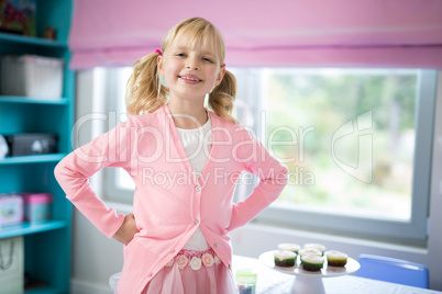 Smiling girl posing in bedroom at home