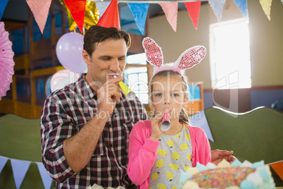 Father and daughter celebrating birthday at home