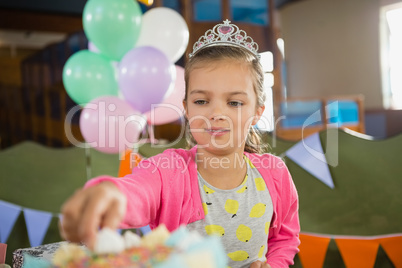 Birthday girl eating cake