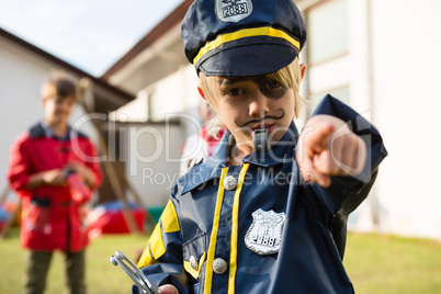 Portrait of boy in police costume
