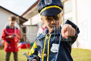 Portrait of boy in police costume