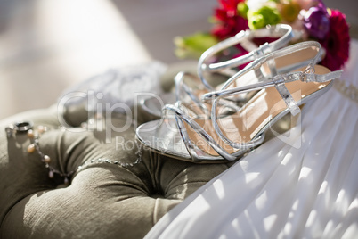 Pair of wedding sandals on sofa