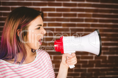 Woman shouting on megaphone