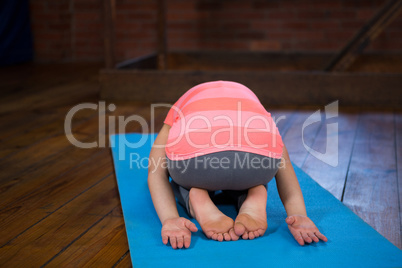 Teenage girl practicing yoga