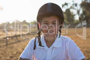 Boy smiling at camera in the ranch