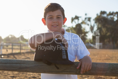 Boy smiling at camera in the ranch