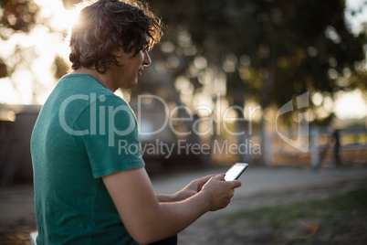 Man using mobile phone in the ranch