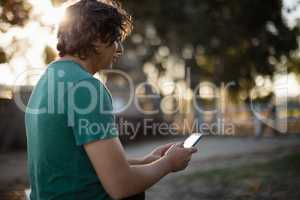 Man using mobile phone in the ranch