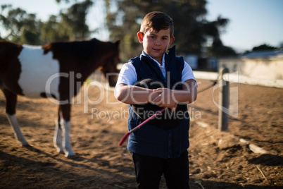 Smiling boy in the ranch on a sunny day