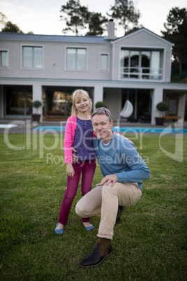 Happy father and daughter together in the garden