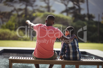 Father pointing something to his son Father pointing something to his son