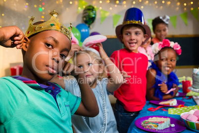 Playful kids at table