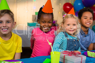 Portrait of smiling children at birthday party