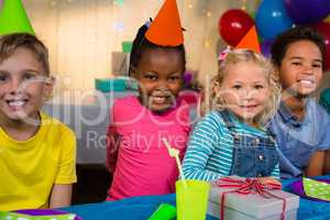 Portrait of smiling children at birthday party