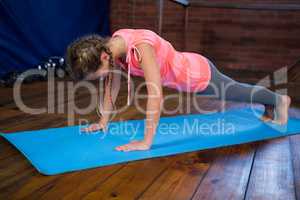 Teenage girl doing push-ups