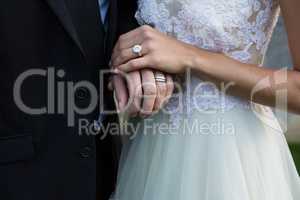 Wedding couple holding hands