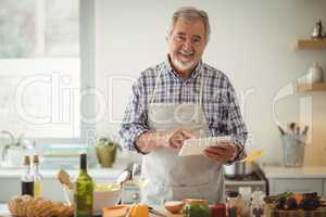 Senior man using digital tablet