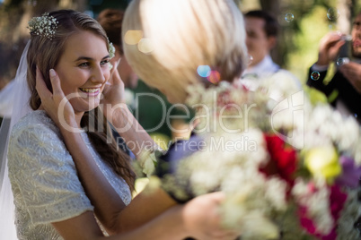 Bride interacting with guests in park