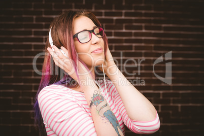 Woman listening music on headphones