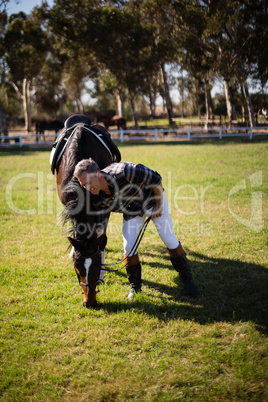 Man standing with horse in the ranch