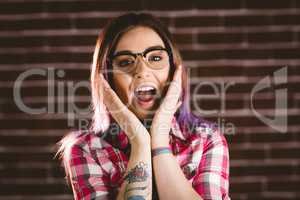 Portrait of shocked woman in spectacles