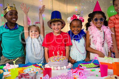 Portrait of cheerful kids at table