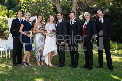Bride and groom standing with guests