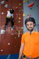 Trainer standing in fitness studio