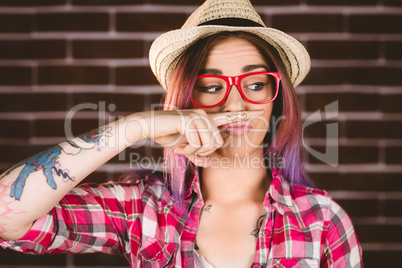 Beautiful woman pretending to have a fake moustache