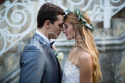 Wedding couple standing face to face