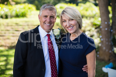 Portrait of happy couple attending a wedding