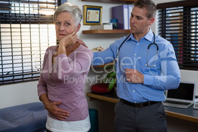 Physiotherapist examining a patient's neck