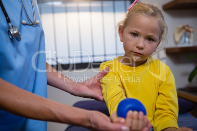 Female doctor examining a little girl