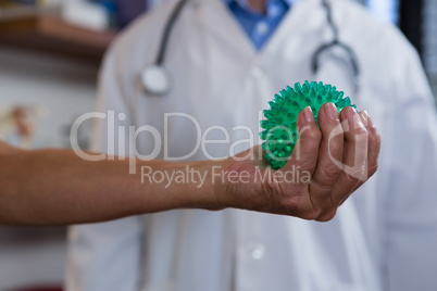 Woman exercising with stress ball