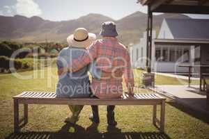 Senior couple sitting together on bench