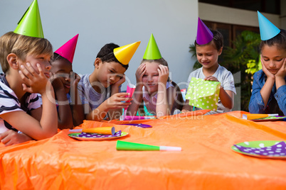Bored children during birthday party