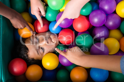 Cropped hand on children pointing on boy