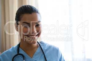Portrait of smiling female doctor in nursing home