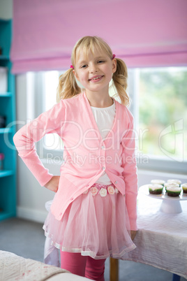 Smiling girl posing in bedroom at home
