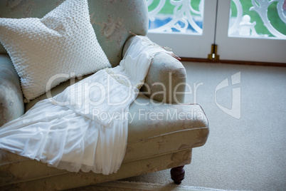 View of wedding dress on sofa