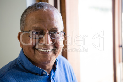 Portrait of happy senior man at nursing home