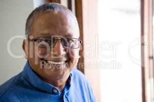 Portrait of happy senior man at nursing home