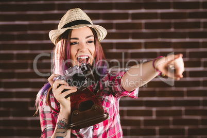 Smiling woman pointing