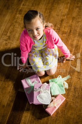 Girl with various gift boxes at home