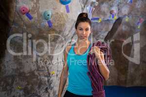 Woman holding rope in fitness studio