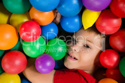 Close up of boy in ball pool