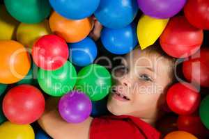 Close up of boy in ball pool