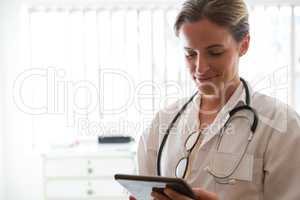 Female doctor using digital tablet in nursing home