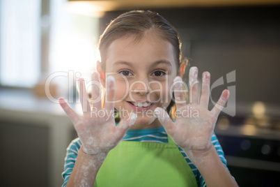 Smiling girl showing her hands